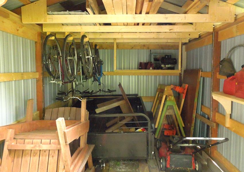 So I added some hooksfor hanging bicycles, and a deep shelf in the ...