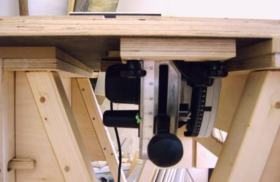 saw under a table to use as a table saw, makingadjustments to the saw 