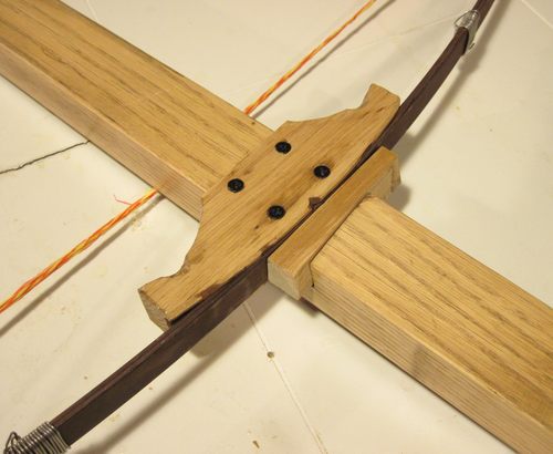 Handmade wooden crossbow with arrows