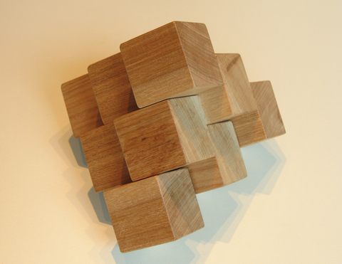 Wooden puzzle in the shape of a pyramid